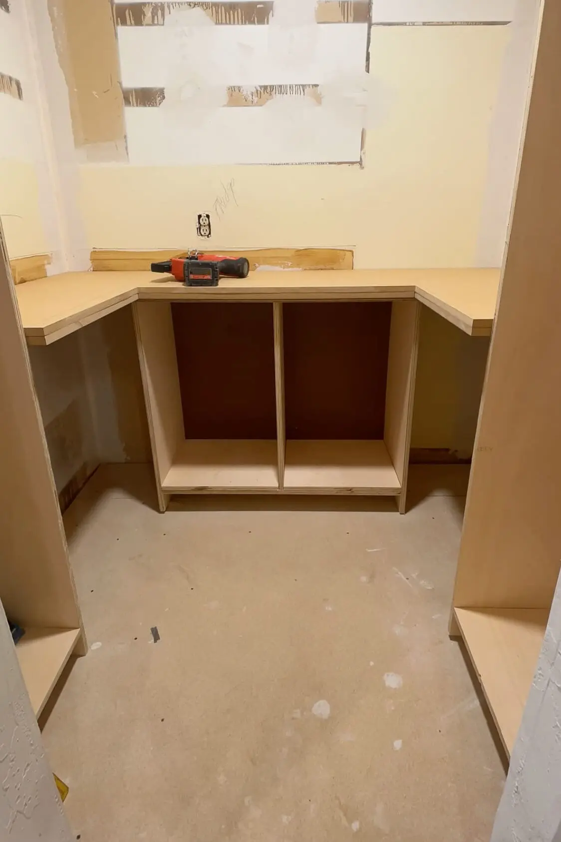 Installing countertop in pantry.